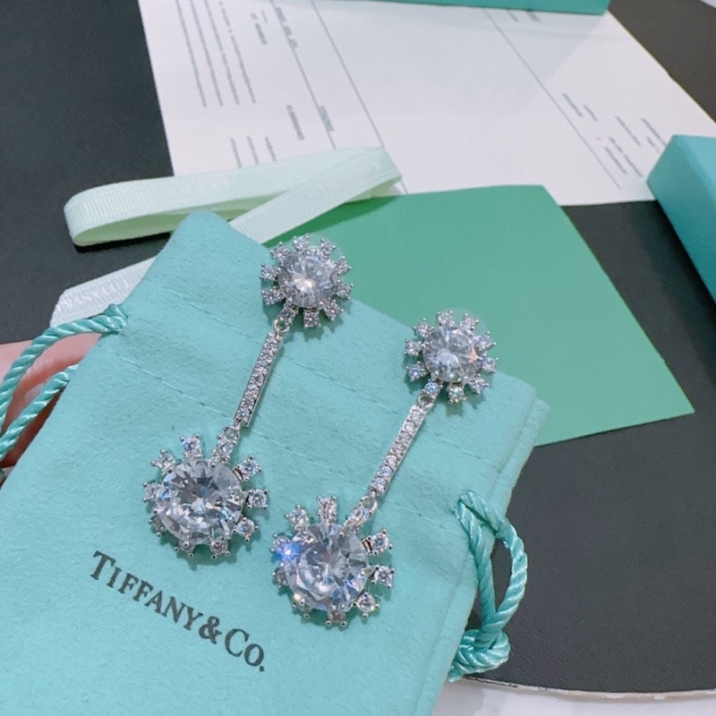 T*f*ny earrings